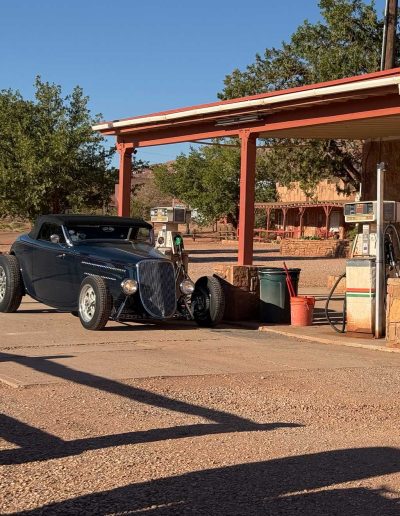 cliffdwellers gas stating Vintage car at old-fashioned gas station