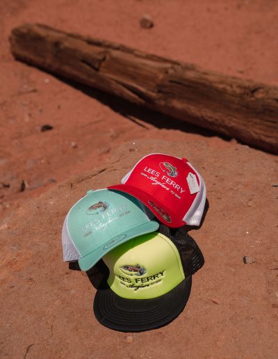 cliffdwellers general store (48) Three colorful Lees Ferry caps on sandy ground